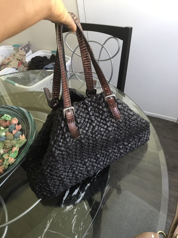 Very beautiful woven leather bag with skin straps