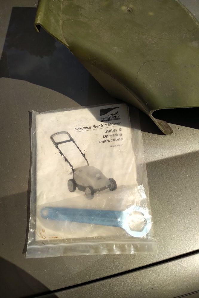 Neutron mower manual, wrench and chute *mower not included