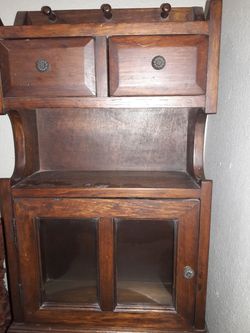 Great item Antique. Solid wood cabinet sits or you can hang on wall