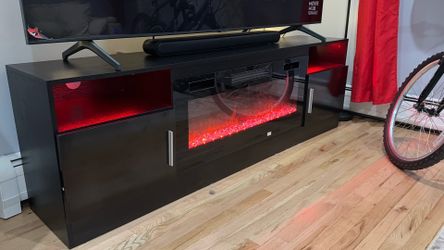 Stand of TV like new with lights and fireplace