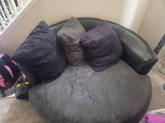 Dark gray and black with leather swivel big comfy chair