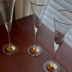 Three tall fluted glasses