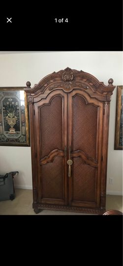 Ornate solid wood armoire by Laura Ashley