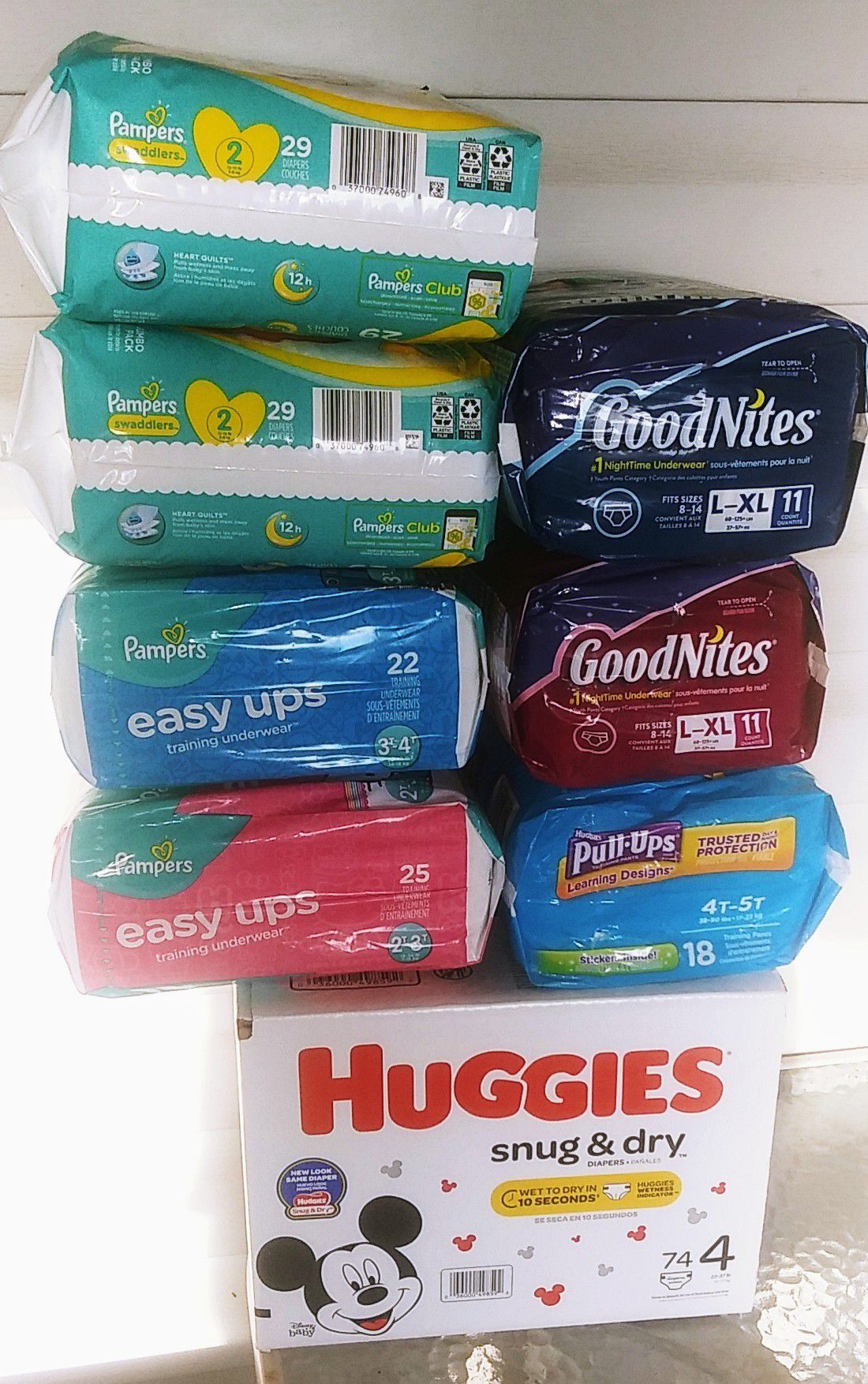 Random sizes of diapers, easy ups & pull ups