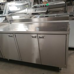 Used All Stainless Steel 60.5" L Cabinet With 3 Doors, Mid-Shelf. And "L" Shape Backsplash