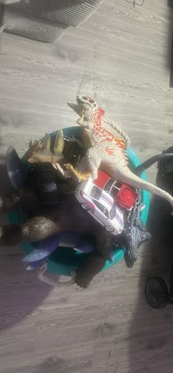 Bucket full of 2015 and 2018  Jurassic World toys, cars and rampage toys,a  Godzilla figure