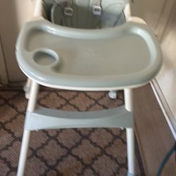 High Chair Like New Four  Wheels Green Color Cover Is Leather 