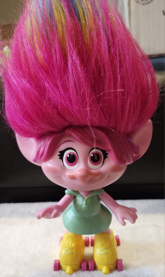 Poppy from Trolls Party Hair Toy, Sings "Hair in the Air?" When You Pull Up Her Hair, Over 40 Sounds and Phrases, on roller skates. Soooo cute!