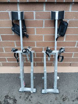 a pair of Drywall stilts there spring loaded and adjustable work great