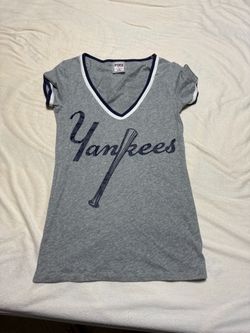 PINK Victoria's Secret short sleeve V-neck tee. Grey body with navy Yankees script and bat graphic.