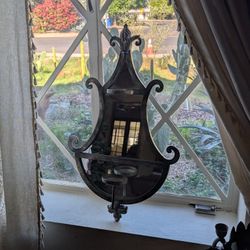 Antique Iron mirror with plant and candle holding space