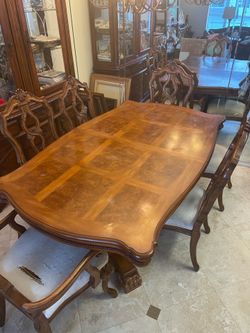Solid wood dining table with 6 chairs .