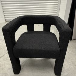 6 Black boucle chairs by Caleb Zipperer