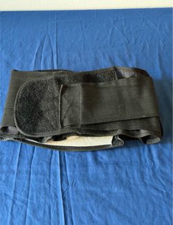 Lumbar support belt with pad