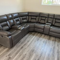 New Reclining Sectional .  Grey Gel Leatherette !  106” X 106”.  Free Delivery !