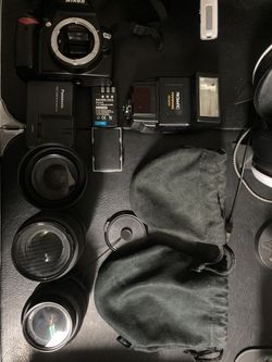 Nikon D60 with 3 lenses ( all have filters), flash, battery charger and 3 batteries.
