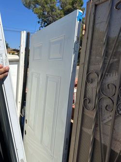 Durable steel 6-panel entry door is white and manufactured by Masonite.  It measures  31 1/2 inches  by 79 inches I have 2 doors available same size s