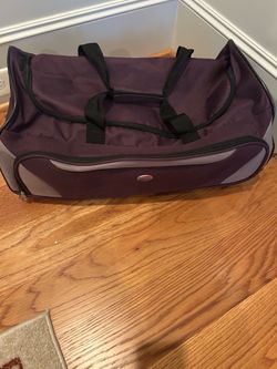 American Tourister rolling bag.