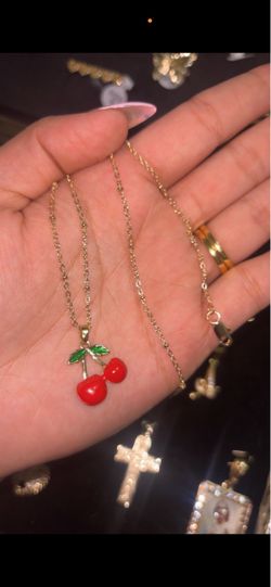Necklace with a cherry pendant