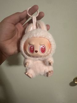 Labubu light pink sitting monster, authentic.