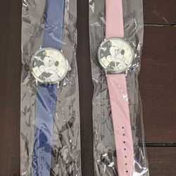 One pink, one blue Mickey mouse watch, not kid sizes great for teens or women