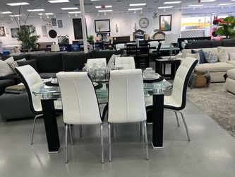 TEMPERED GLASS DINNING TABLE  W  6   LEATHERETTE CHAIRS  (58 “x 35” )