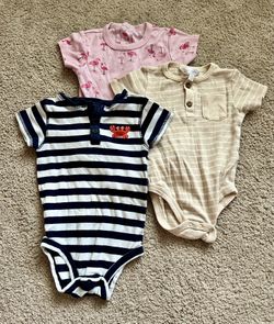 Bundle of three short-sleeve baby girl onesies, size 24 months