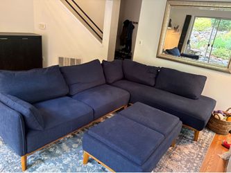 Blue sectional sofa with storage ottoman