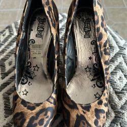 Leopard Pattern And Rediculous Red High Heels