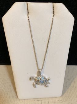 Beautiful silver tortoise pendant with silver chain.