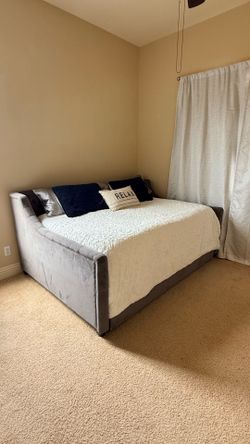 Daybed with a trundle and a mattress