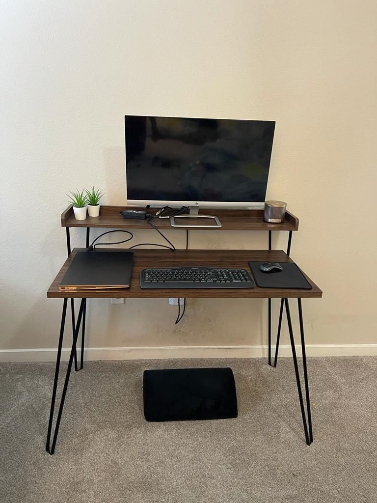 4 months old office desk (with riser)is available for sale - Already assembled