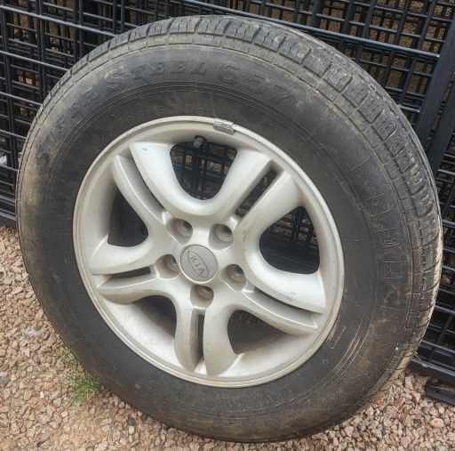 (1) Tire 235 60 R16 & KIA Rim