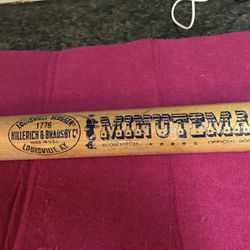 Louisville Slugger, 34 inches softball bat. Minuteman made in USA