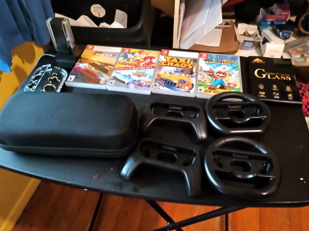 Nintendo Switch With 8 Games 4 Joy-con Chargers 2 Wheels Carry Case Stylus Holder For Games 2 Extra Sets Silicone Overlays
