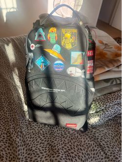Sprayground backpack with tags