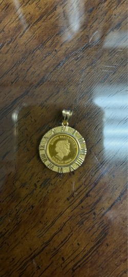 18k solid gold pendant with 999.9 24k coin pick up only!!