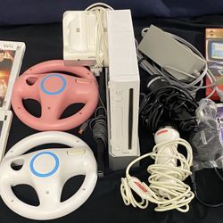 Nintendo Wii Bundle - Console, Games & Accessories- Dual Remote Charger, Konami Microphones, 4 Steering Wheels for Mario Kart, Games, Etc.