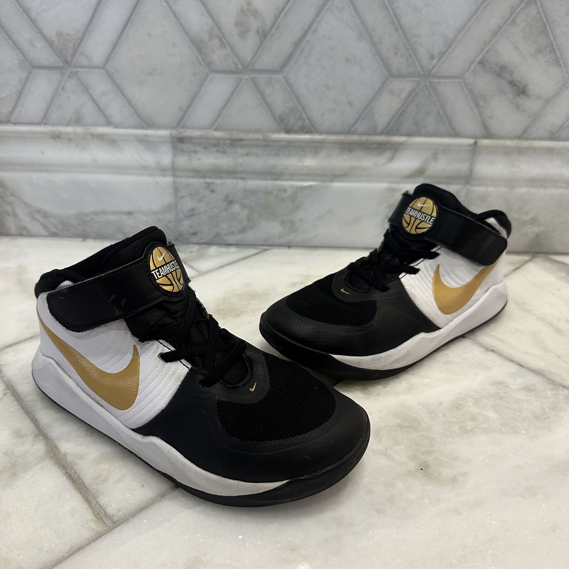 Size 3 Kids Nike Team Hustle Black, White and Gold Basketball Sneaker Shoes