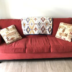 Three seater red couch sofa