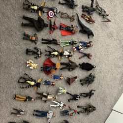 Box Full Of Action Figures From Neca, Hasbro, And Marvel Legends 