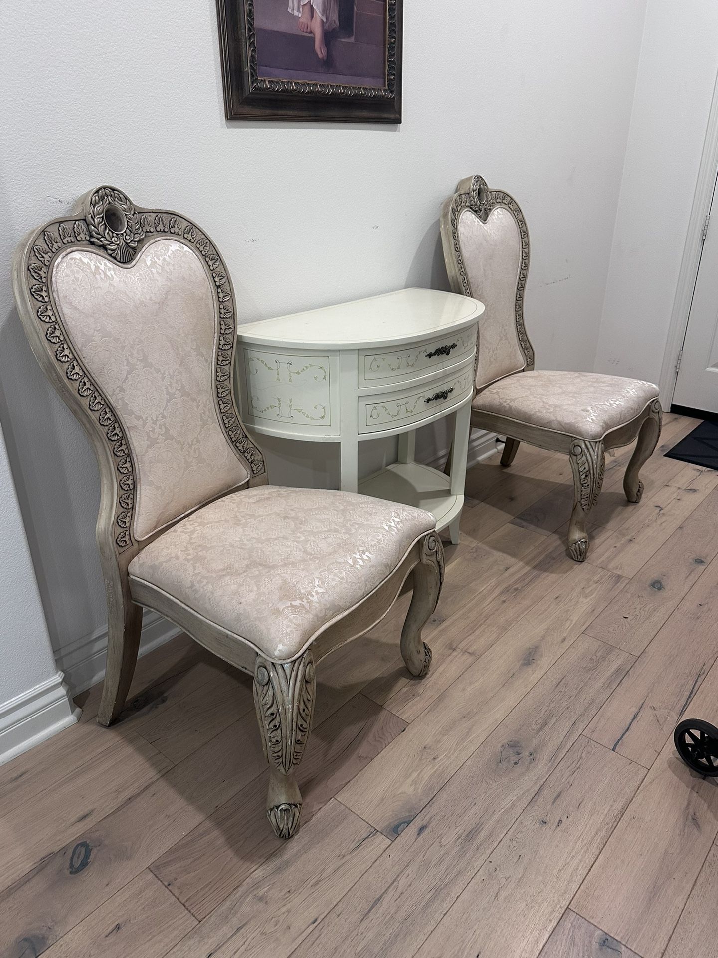Classic upholstered chairs with a decorative console tabl
