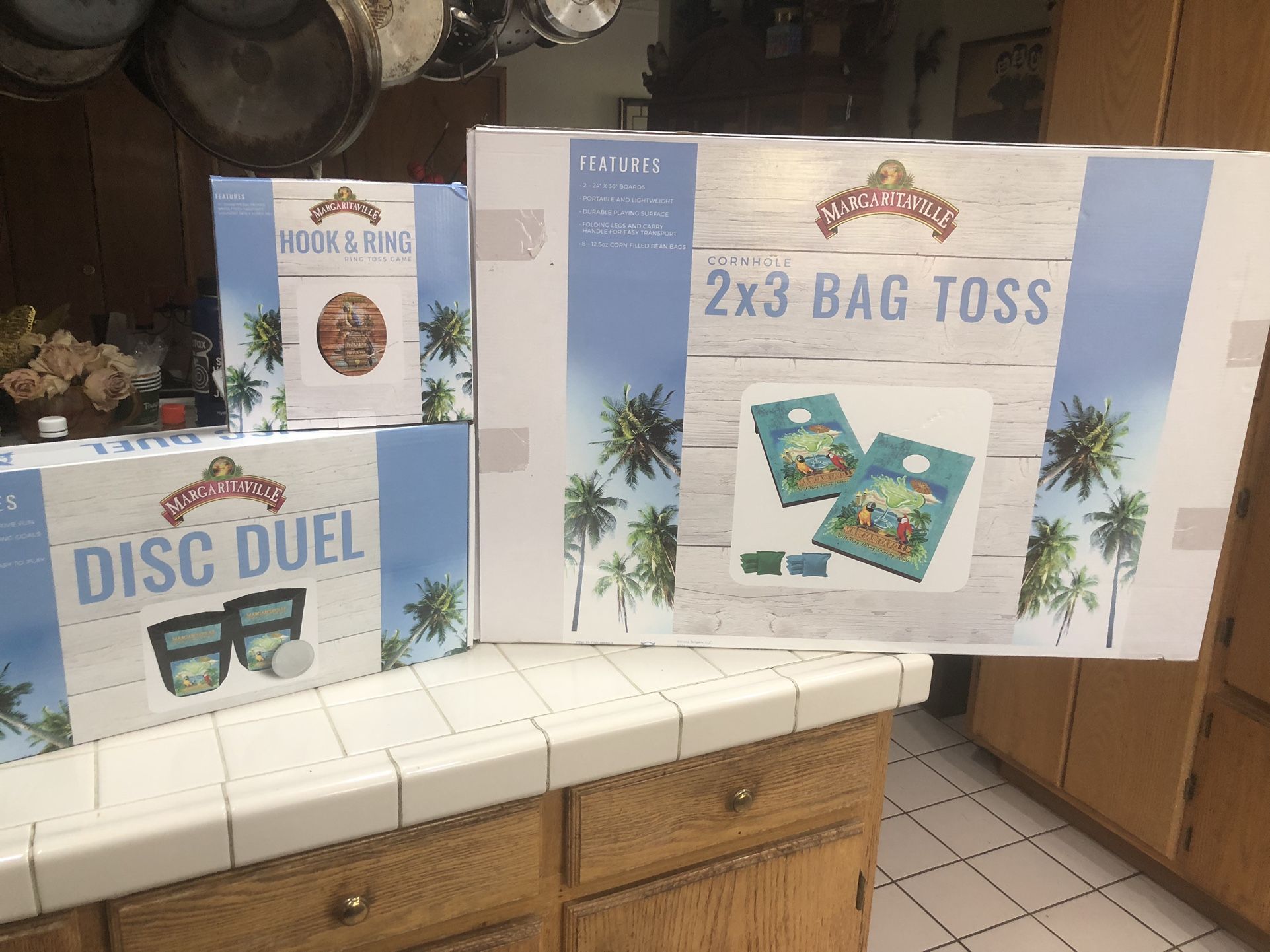 Margarita, game corn hole toss diss duel game and hook ring game all three of them $130 All brand new inbox.