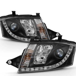 2000-2006 AUDI TT BLACK PROJECTOR HEADLIGHTS WITH LED RUNNING DAYTIME LAMPS.