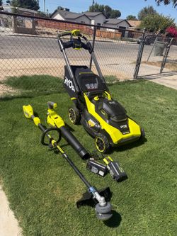RYOBI 3-Piece Kit: 22-inch Rear-Wheel Drive Dual-Blade Mower, Trimmer, and Blower; (2) Batteries (6Ah & 4Ah); (1) Charger.