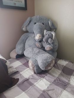 Elephant 🐘 lover's, mommy with baby 5 feet tall X 2 1/2 feet wide, super cute clean, no rips or holes just sits in spare room.