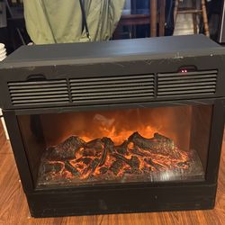 Heat surge electric fireplace