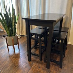 Small high top table with 4 stools