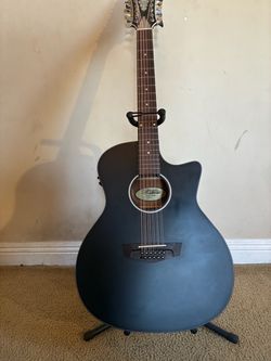 12 string D’Angelico Guitar + two packs of elixir strings