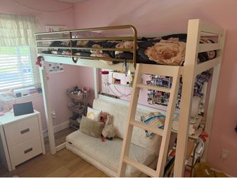 Metal loft bed with gold toned metal safety rail